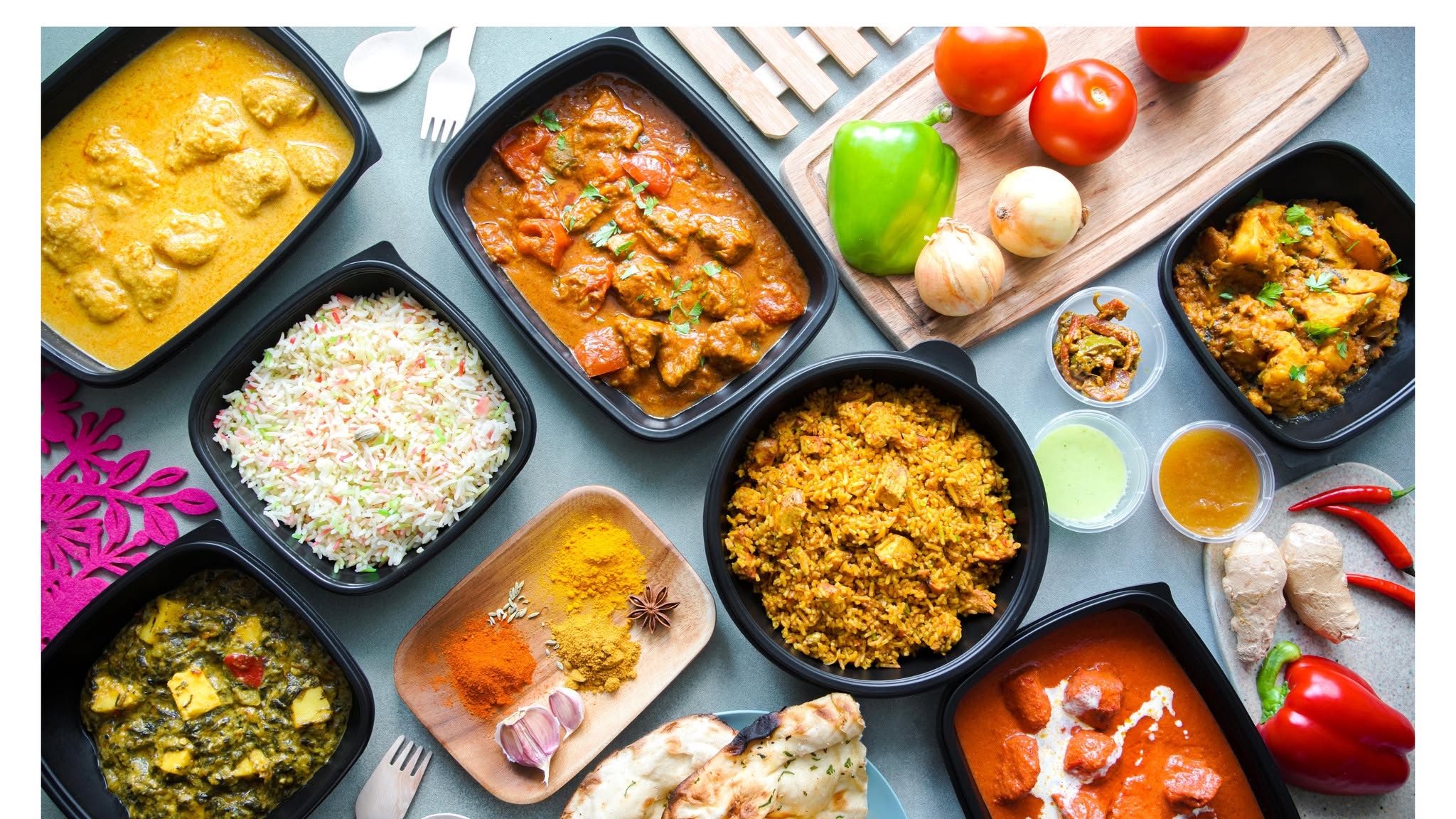 A Desi Spice spread of curries, rice, bread and chutneys
